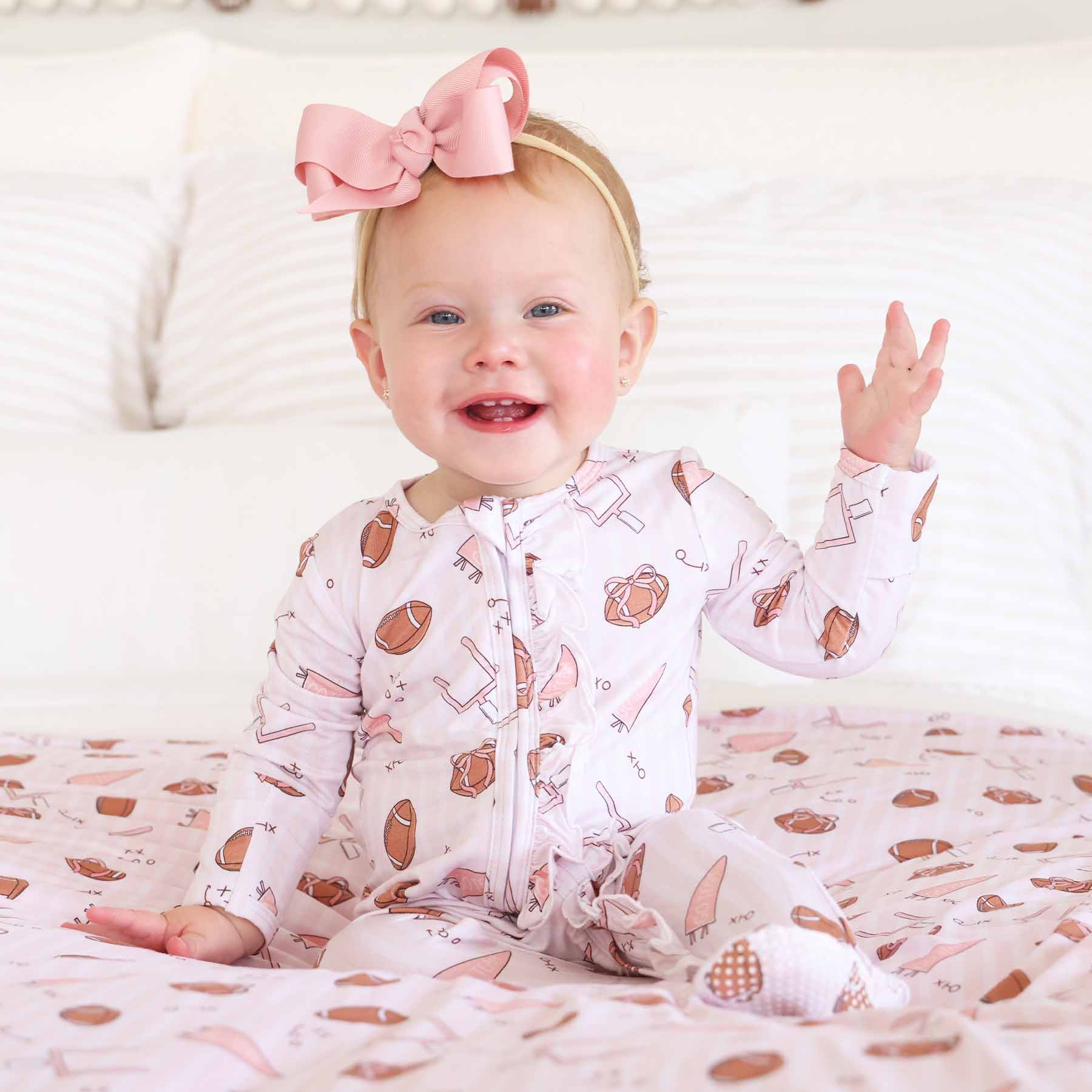 Tiny Touchdowns Ruffle Zipper Footie | Pink