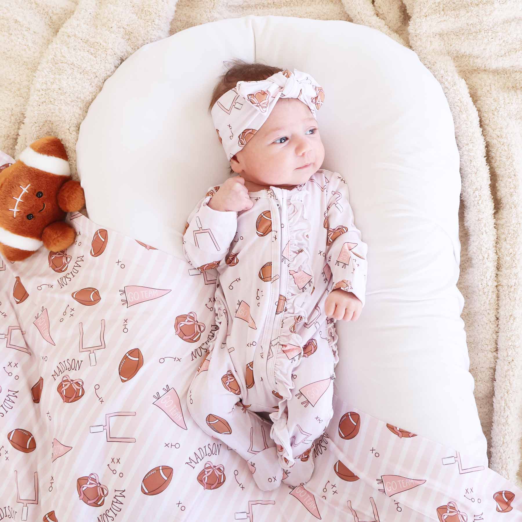 Tiny Touchdowns Ruffle Zipper Footie | Pink